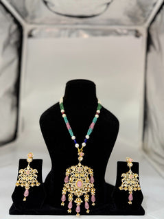 REAL LOOKING SILVER SET WITH PINK BEADS
